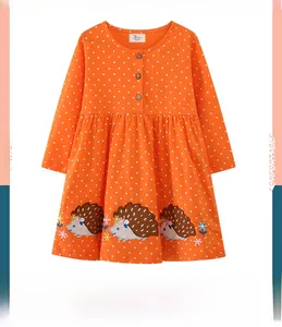 Detail of girls orange polka dot dress with hedgehog embroidery and button collar