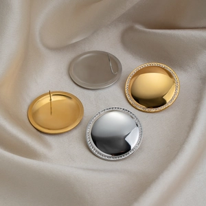 Polished 18K gold and silver plated round stud earrings with rhinestones on silk