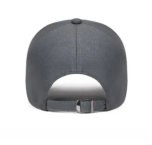 Detail of dark grey baseball cap back with adjustable metal buckle and cotton fabric