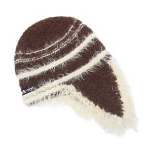 Detail of winter knit earflap hat showing contrast textures and nk vivi logo tag
