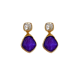 Vintage gold earrings featuring clear square gems and textured purple rhombus stones
