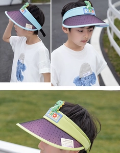 Close-up of kids dinosaur sun visor showing breathable mesh and UV color-changing brim