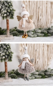 Detail of Christmas tree angel ornaments in champagne and silver with glittery wings