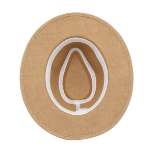 Internal detail of a woven straw hat featuring a white sweatband and washing label