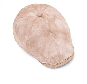 Top view of a beige newsboy cap showing soft suede texture and button detail