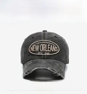 Front view of a charcoal gray vintage washed baseball cap with New Orleans embroidery