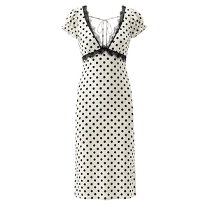 French vintage polka dot dress with V-neck lace trim and short puff sleeves on white