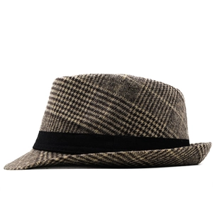 Detail view of British retro grey brown plaid wool fedora hat with black ribbon band
