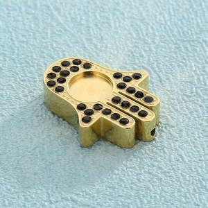 Golden Hamsa hand pendant with black micro-paved crystals and vertical opening hole