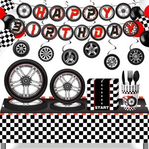 Racing theme party set featuring tire banners, checkered napkins and paper tableware