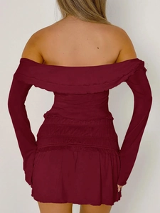 Back view of red off-shoulder long sleeve dress with ruffled hem and elastic waist