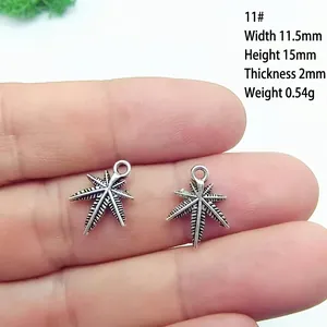 Detail view of leaf charms with dimensions 11.5x15mm showing thickness and weight