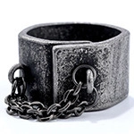 Detail shot of vintage distressed grey metal ring with double rings and chain accents
