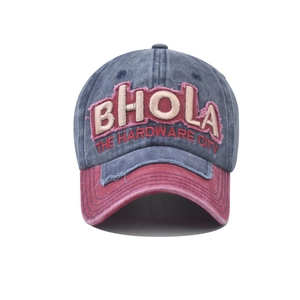 Detail of BHOLA patchwork baseball cap showing blue denim fabric and red embroidery