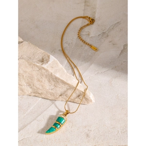 Detail of 18K gold plated necklace with turquoise cat-eye stone pendant and 18K hallmark