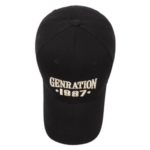 Black cotton baseball cap with white GENRATION 1987 embroidery and curved brim