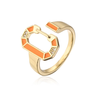 Detail of 18K gold-plated D-shape ring with orange enamel and cubic zirconia accents