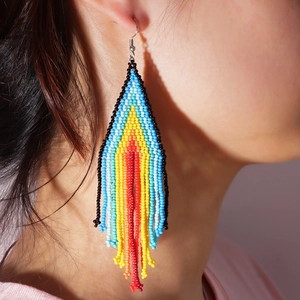 Handmade bohemian beaded tassel earrings featuring colorful geometric tribal patterns