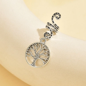 Close-up of a silver Tree of Life pendant earring with an oxidized vintage metal finish