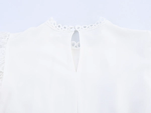 Detail of elegant lace collar and back teardrop cutout with button on white shirt