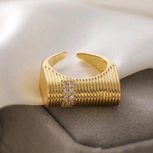 18K gold plated open heart ring with zircon inlay and striped texture on white silk