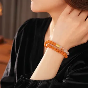 Double-layer yellow bodhi seed bracelet with vintage Chinese style beads and golden charm