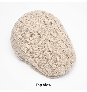 Top view of beige cable knit ivy cap showing thick wool texture and warm winter style