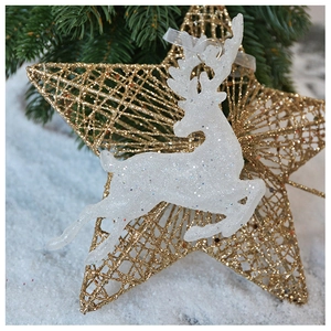 Close-up of sparkling white reindeer and golden hollow star Christmas tree ornaments