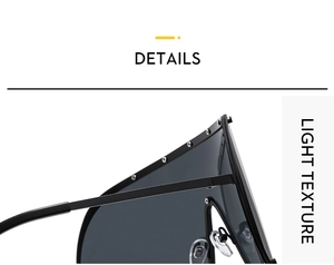 Detail of black oversized sunglasses showing silver rivets and lightweight texture
