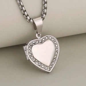 Silver heart locket necklace with sparkling rhinestones on a delicate box chain