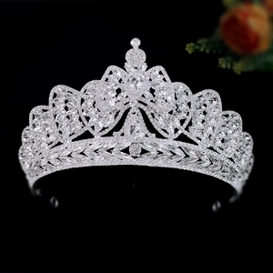 Elegant silver bridal tiara with sparkling crystal leaves and floral patterns on black background