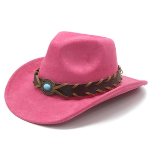 Macro detail of pink suede cowboy hat with braided leather band and turquoise stone