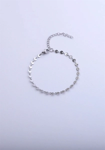 Close-up of silver stainless steel chain bracelet with lobster clasp and extender link
