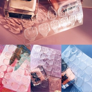 Strong transparent double-sided adhesive tabs for press-on nails in various sizes