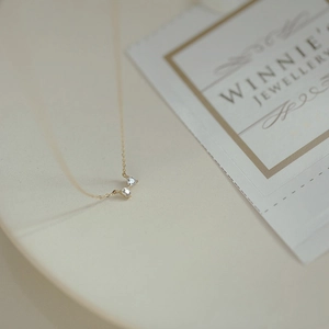 Minimalist S925 silver bow necklace with 14k gold heart mini pendant and white stones