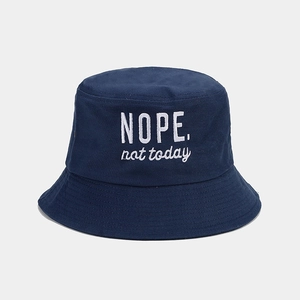 Close-up of 'NOPE. not today' embroidery on a breathable cotton navy bucket hat