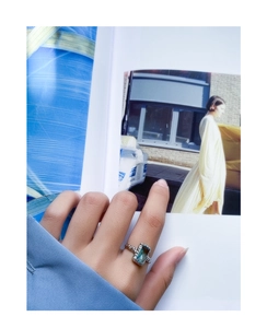 Macro shot of S925 silver ring featuring rectangular sea blue gemstone and vintage texture