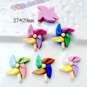 Detailed view of colorful 27x29mm acrylic windmill charms for DIY accessories