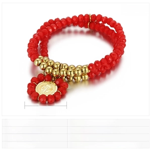 Detail of red multilayer beaded bracelet with gold stainless steel coin pendant