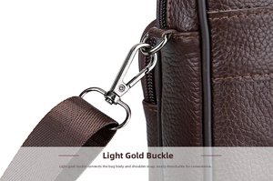 Close-up of premium brown lychee grain leather bag with light gold metal hook buckle