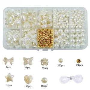 Detail view of DIY jewelry kit with pearl stars, hearts and elastic thread in a box