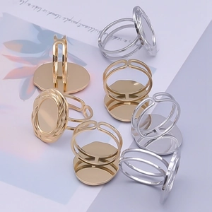 Macro detail of adjustable oval stainless steel ring bases in gold and silver finishes