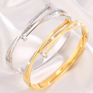 Polished titanium steel nail bracelets in gold and silver finish with crystal pavé stones