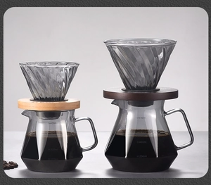 Detail of glass pour over coffee set with spiral dripper and scaled sharing carafe