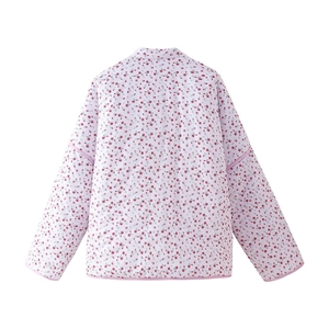Rear view detail of a white quilted jacket featuring a red floral pattern and pink piping
