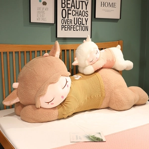 Detail of soft plush sheep dolls in knitted sweaters on a cozy bedroom background