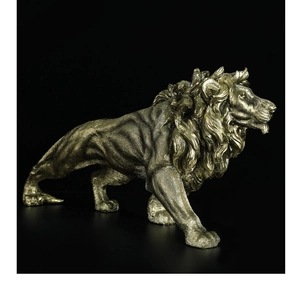 Macro view showing the detailed muscle lines and mane of a gold lion resin statue