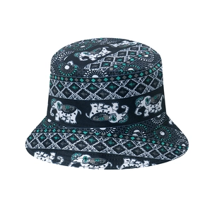 Detailed close-up of ethnic elephant prints and geometric patterns on a black bucket hat
