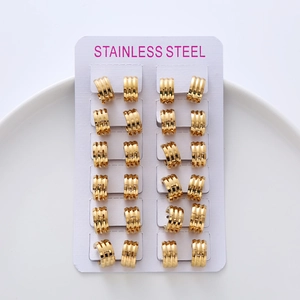 Set of 12 pairs of minimalist gold stainless steel hoop earrings on a white display card