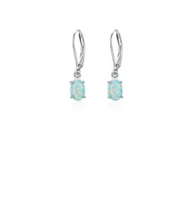 Macro detail of silver French hook earrings with oval blue iridescent opal stones